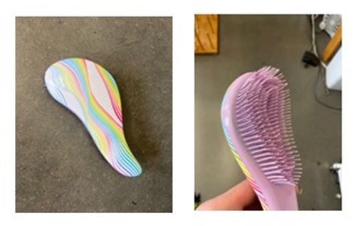 Two side by side images of a tangle teaser brush. One shows the back, which has a rainbow colour pattern, and the other shows the plastic bristles.