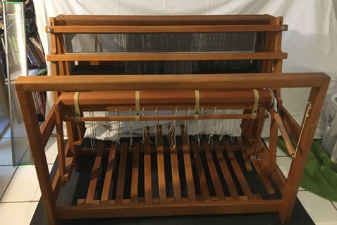 An eight shaft floor loom, with no warp on it.